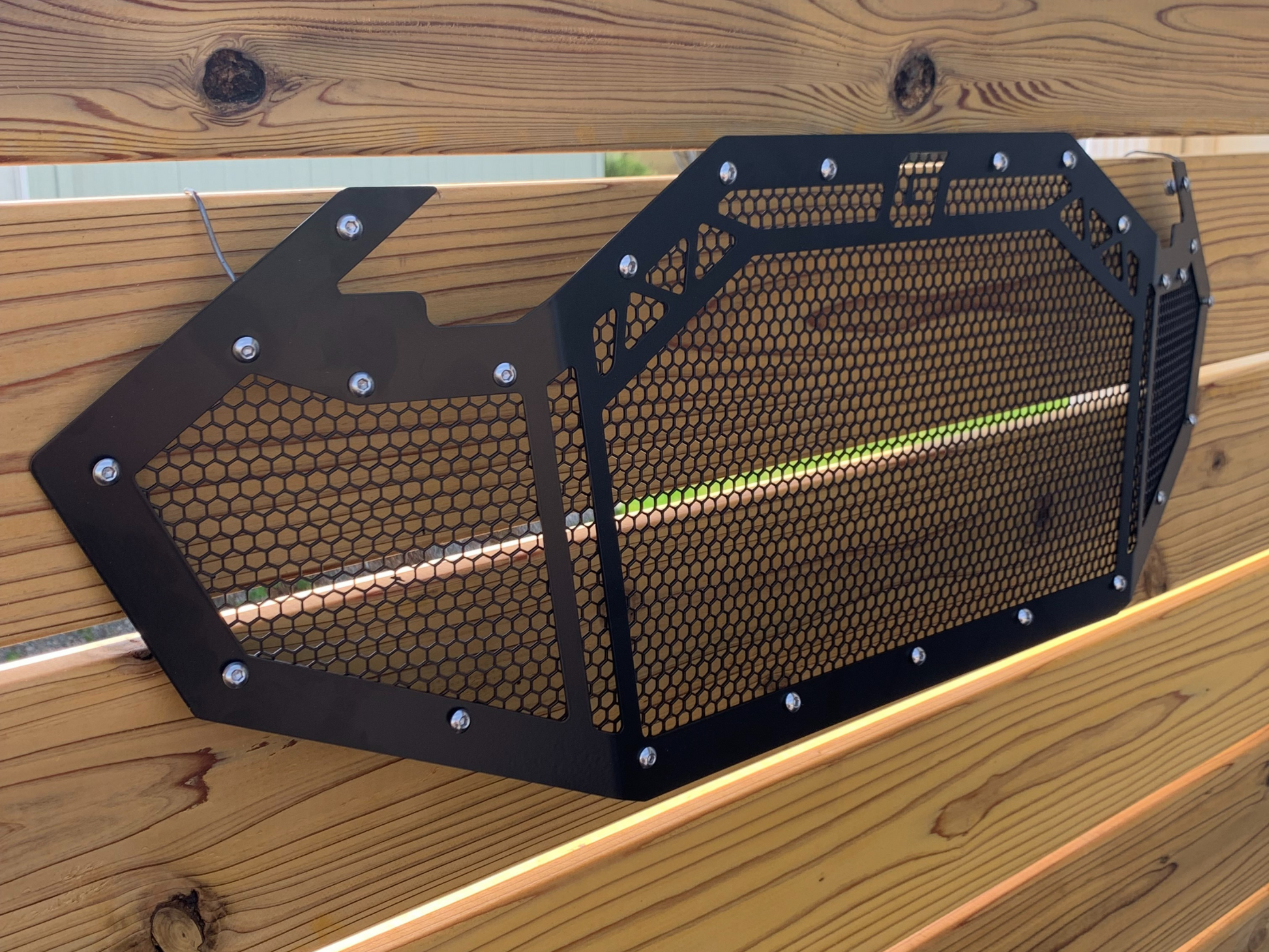 side angle of greanland offroad grile with black mesh