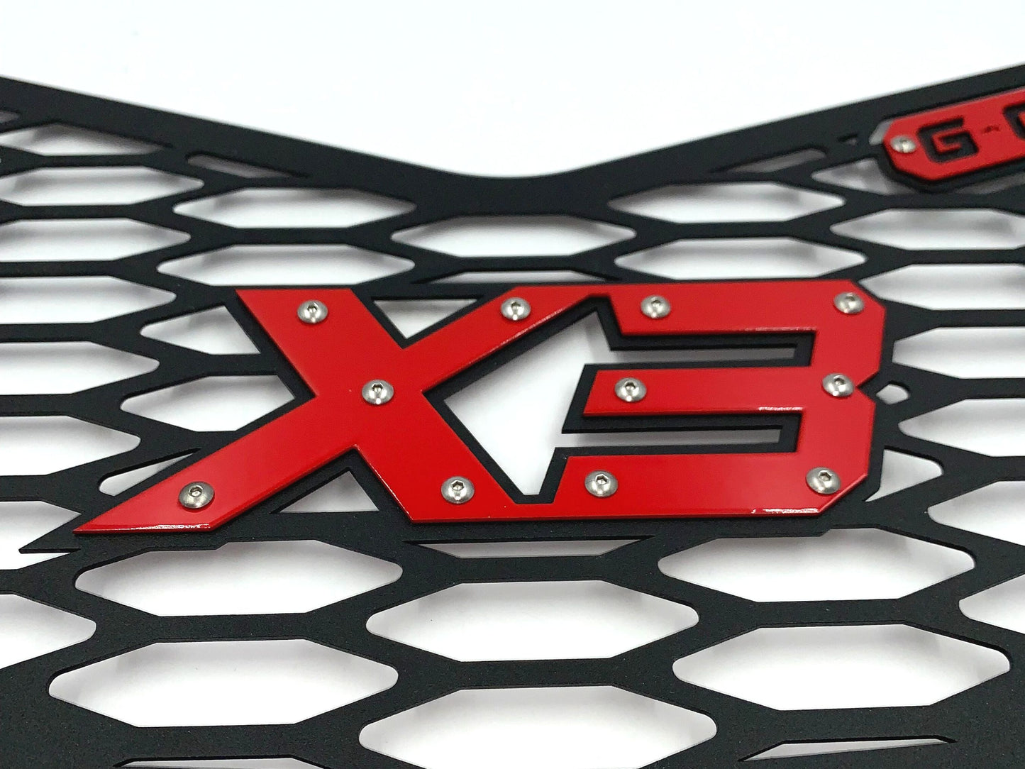 red x3 logo on greanland offroad grille