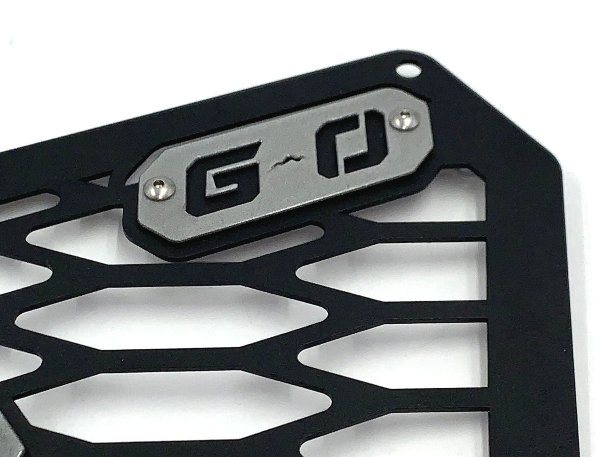 silver greanland offroad logo on can am x3 grille