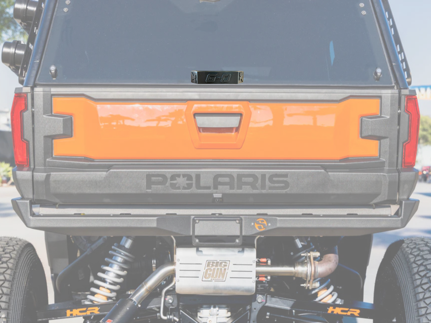 Polaris vehicle with orange accent and visible branding